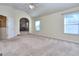 Carpeted bedroom with an open door to another room and a ceiling fan at 2817 Village Park E Dr, Ellenwood, GA 30294