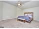 A carpeted bedroom features a queen bed, a ceiling fan and plenty of light at 2817 Village Park E Dr, Ellenwood, GA 30294