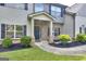 Inviting front entrance with brick accents, well-maintained landscaping, and walkway leading to the front door at 2817 Village Park E Dr, Ellenwood, GA 30294