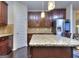 Granite kitchen island with seating and stainless steel appliances at 2817 Village Park E Dr, Ellenwood, GA 30294