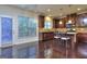 Well-lit kitchen with stainless steel appliances, dark wood cabinetry, and modern lighting fixtures at 2817 Village Park E Dr, Ellenwood, GA 30294