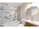 Updated bathroom featuring modern fixtures and stylish marble tile at 1737 Cahoon Sw St, Atlanta, GA 30310