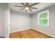 Cozy bedroom featuring hardwood floors and a sunny window with blinds at 1737 Cahoon Sw St, Atlanta, GA 30310