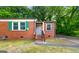 Charming brick home featuring well-kept landscaping and a cozy front entrance at 1737 Cahoon Sw St, Atlanta, GA 30310