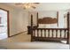 Bedroom featuring a ceiling fan and a four-poster bed with decorative woodwork at 360 Darren Dr, Fayetteville, GA 30215