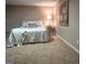 Comfortable bedroom featuring soft carpet, a cozy bed, and a decorative lamp, creating a peaceful sanctuary at 360 Darren Dr, Fayetteville, GA 30215