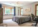 Bedroom with a bay window, comfortable bed, a work desk, and relaxing natural light at 360 Darren Dr, Fayetteville, GA 30215