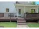 A wooden deck with seating offers outdoor space for relaxation and entertaining at 360 Darren Dr, Fayetteville, GA 30215