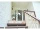 A front porch with stone steps features a decorative plant and exterior lighting at 360 Darren Dr, Fayetteville, GA 30215
