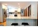 Spacious kitchen featuring granite countertops, stainless appliances, and breakfast bar seating at 360 Darren Dr, Fayetteville, GA 30215