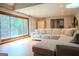 Cozy living room featuring a large L shaped couch and a large sliding glass door with backyard views at 360 Darren Dr, Fayetteville, GA 30215