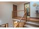 Carpeted staircase with wooden railing leading to the second floor, overlooking the kitchen at 360 Darren Dr, Fayetteville, GA 30215
