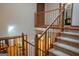 Carpeted staircase with wooden railing leading to the second floor, overlooking the living room at 360 Darren Dr, Fayetteville, GA 30215
