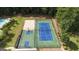 Overhead view of the community basketball and tennis courts with surrounding trees and landscaping at 416 Fairway Dr, Acworth, GA 30101