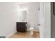 Bathroom featuring vanity with dark wood cabinets, toilet, and shower at 416 Fairway Dr, Acworth, GA 30101