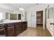 Primary bathroom featuring a double vanity, soaking tub, and walk-in closet at 416 Fairway Dr, Acworth, GA 30101