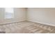 Bedroom with neutral carpet, base molding, a window with blinds, and an electrical outlet at 416 Fairway Dr, Acworth, GA 30101