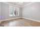 Bright bedroom with vinyl floors, neutral walls, ceiling fan, and window at 416 Fairway Dr, Acworth, GA 30101
