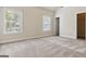 Bedroom showcasing natural light from windows, neutral walls, and plush carpeting at 416 Fairway Dr, Acworth, GA 30101