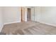 Spacious bedroom with neutral walls and carpeting ready for personalization at 416 Fairway Dr, Acworth, GA 30101