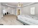 Expansive bedroom with a ceiling fan, open layout, and doorway to an en-suite office at 416 Fairway Dr, Acworth, GA 30101