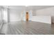 Bonus room with hardwood floors, white walls, a light fixture, and two doorways at 416 Fairway Dr, Acworth, GA 30101