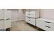 Walk-in closet featuring custom shelving and drawers for optimal storage at 416 Fairway Dr, Acworth, GA 30101