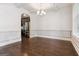 Elegant dining room with hardwood floors, white trim, and view of kitchen at 416 Fairway Dr, Acworth, GA 30101