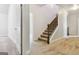 Hallway with stairs, neutral walls, and plush carpeting ready for personalization at 416 Fairway Dr, Acworth, GA 30101