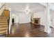 Large living room with hardwood floors, stone fireplace, and staircase to the second floor at 416 Fairway Dr, Acworth, GA 30101