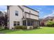 View of screened porch with black screens, brown columns, manicured lawn and landscaping at 416 Fairway Dr, Acworth, GA 30101