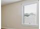 Beige bedroom wall with trim, a double hung window with blinds, and an electrical outlet at 416 Fairway Dr, Acworth, GA 30101