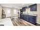 Kitchen features gray countertops and blue cabinetry at 186 Ashley Dr, Mcdonough, GA 30252