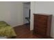 Bedroom featuring wood floors, a closet, and a dresser at 3248 Brisbane Way, Lithonia, GA 30038