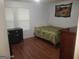 Bedroom showcasing a bed, dresser, and neutral walls, creating a comfortable and relaxing atmosphere at 3248 Brisbane Way, Lithonia, GA 30038
