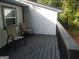 View of the deck with chairs and wooded surroundings at 3248 Brisbane Way, Lithonia, GA 30038