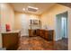 Basement bar area featuring wooden cabinets, sink, wine storage, mini-fridge, and granite countertops at 4311 Hampton Mill Pkwy, Douglasville, GA 30135
