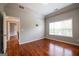 Bedroom features a trey ceiling, hardwood floors, and a window providing natural light at 4311 Hampton Mill Pkwy, Douglasville, GA 30135