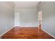 Bright bedroom featuring hardwood floors, neutral paint, and a vaulted ceiling at 4311 Hampton Mill Pkwy, Douglasville, GA 30135