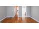 Spacious bedroom with hardwood floors and easy access to bathroom and hallway at 4311 Hampton Mill Pkwy, Douglasville, GA 30135