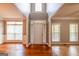 Bright foyer featuring hardwood floors and a centered front door flanked by sidelight windows at 4311 Hampton Mill Pkwy, Douglasville, GA 30135
