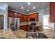 Well-appointed kitchen boasts granite countertops, modern stainless steel appliances, and ample cabinetry for storage at 4311 Hampton Mill Pkwy, Douglasville, GA 30135