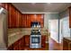 Kitchen with gas range, granite countertops, and stainless appliances offering both style and functionality for cooking needs at 4311 Hampton Mill Pkwy, Douglasville, GA 30135