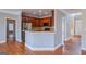 Stylish kitchen showcasing stainless steel appliances, a center island, and seamless transition to the living and dining area at 4311 Hampton Mill Pkwy, Douglasville, GA 30135