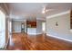 Spacious living room featuring hardwood floors that flow into the open kitchen area, bathed in natural light at 4311 Hampton Mill Pkwy, Douglasville, GA 30135