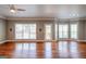 Bright living room featuring hardwood floors, large windows offering scenic views, and direct access to the outdoor deck at 4311 Hampton Mill Pkwy, Douglasville, GA 30135