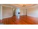 Spacious main bedroom with hardwood floors, tray ceilings, and access to ensuite bath at 4311 Hampton Mill Pkwy, Douglasville, GA 30135
