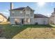 View of the backyard with a small patio and chairs at 453 Camp Hill Ln, Jonesboro, GA 30238