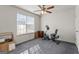 Bedroom with carpet floors, ceiling fan, a window with natural light, and an exercise bike at 453 Camp Hill Ln, Jonesboro, GA 30238