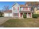 Charming two-story home with red shutters, light blue siding, and a well-manicured lawn at 453 Camp Hill Ln, Jonesboro, GA 30238